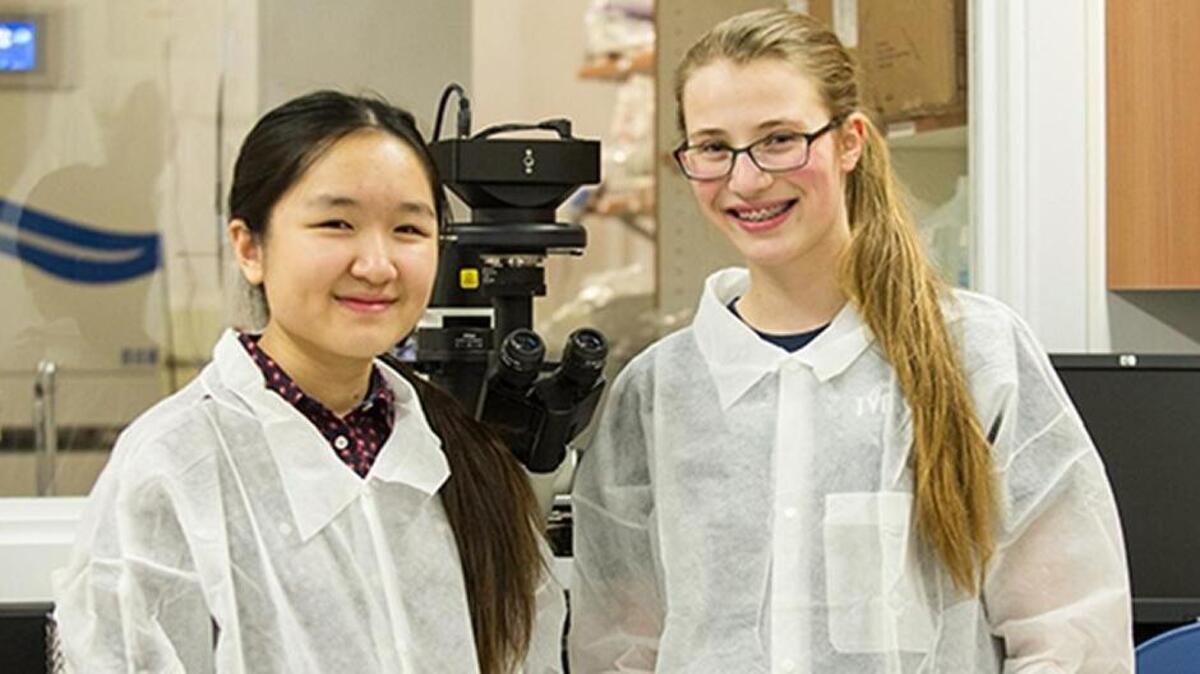 Catherine Ji, left, and Brynne Coulam are awaiting word that their science experiment has reached the International Space Station.