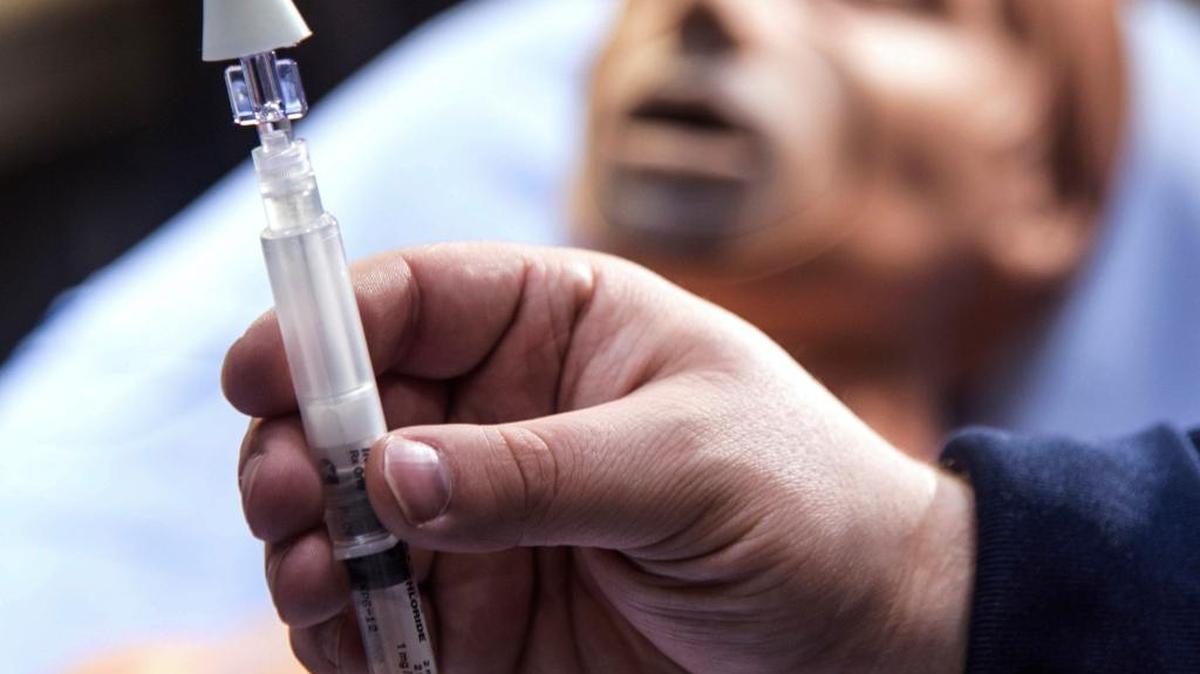 Chris Humor, a paramedic with Carle Arrow Ambulance in Champaign, Illinois, holds a syringe with a mist atomizer used to dispense Narcan, the emergency, life-saving antidote for opioid overdose victims. Boise State and Idaho State universities both keep Narcan on hand in case of overdoses on campus.