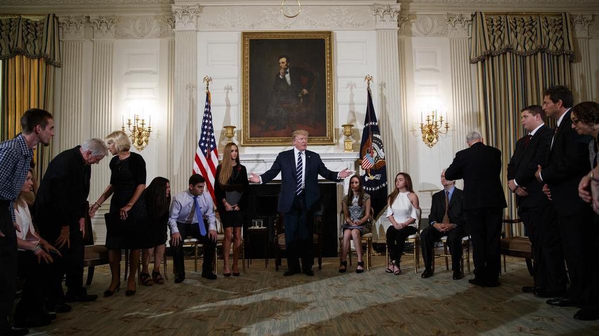 President Donald Trump hosts a listening session with high school students, teachers and others in the State Dining Room of the White House in Washington, D.C., on Wednesday.