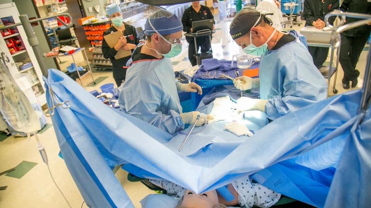 Students perform a simulated appendectomy surgery during a clinical exam at the College of Western Idaho Boise Center Ada County Campus. CWI officials say they need better space for health sciences education.