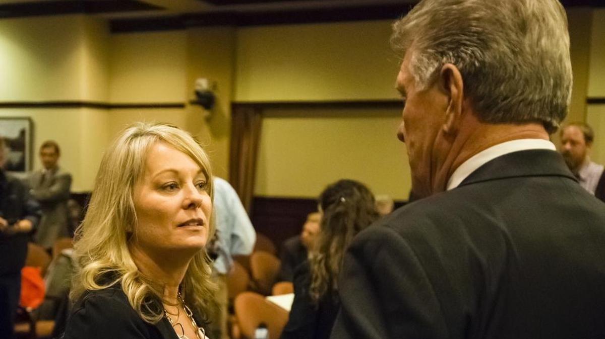 Idaho State Superintendent of Public Instruction Sherri Ybarra visits with Gov. Butch Otter at a pre-Legislature briefing for reporters Jan. 6.