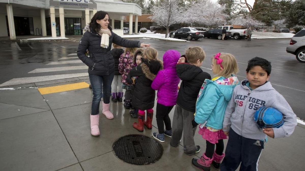 Amber Espinoza lines up her kindergarten class at the end of recess at Sage International School of Boise. The property became tax-exempt when the school moved into empty commercial buildings on ParkCenter Boulevard.