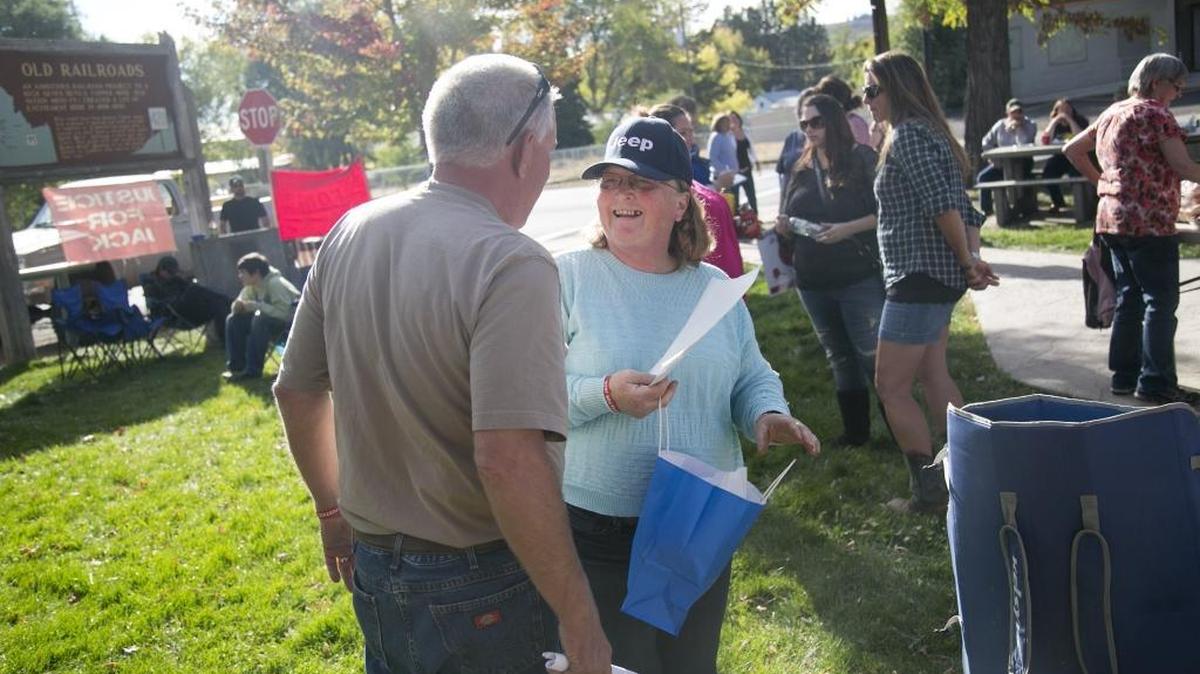 Donna Yantis laughs as she talks with Michael McLaughlin at a Justice for Jack event in Council Saturday.