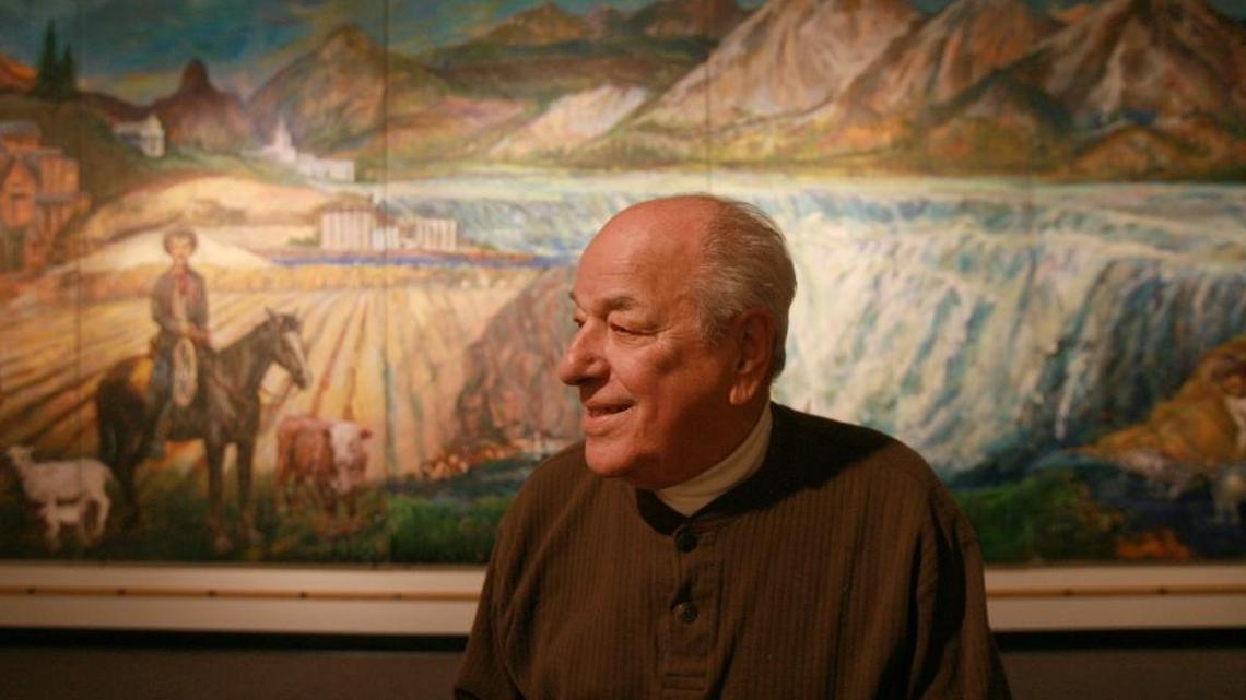 John Collias, at 86, pictured in front of a mural he created for the Bicentennial in 1976. Collias died on March 29 at 98.