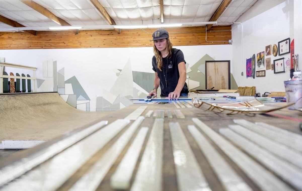 Brigette Nelson works on glass art at her studio. Nelson recent opened Garden City Projects, a combination glassworks studio, skateboard ramp and barber shop.