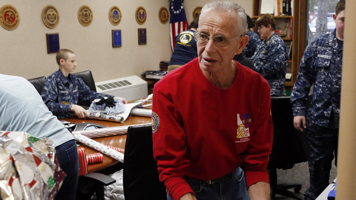 Phil Hawkins volunteers during a recent wrapping day at the Idaho State Veterans Home, which is still seeking more donations for warm undergarments, including long johns and socks, for women who are homeless in the community.