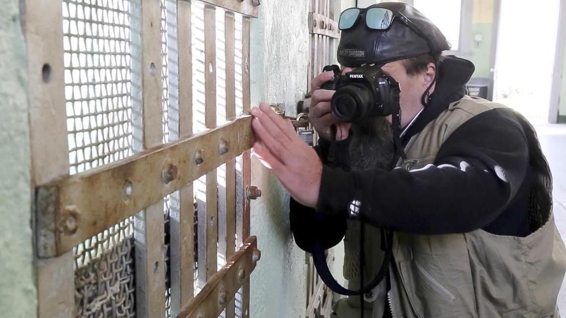 Jamie Harrell, who is legally blind, reaches out to get a better sense of what’s in his camera frame on a recent visit to the Old Penitentiary in Boise. He is able to see things better just inches in front of his face, so he uses the LCD viewing screen on the digital camera to compose his photos. He’s hoping to soon acquire eSight glasses that use a similar principle to help the sight impaired.