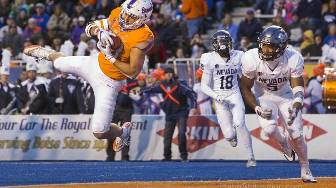 Boise State tight end Jake Roh (88) makes a diving catch into the end zone defended by Nevada defensive back Dameon Baber (5) Saturday, Nov. 4, 2017 at Albertsons Stadium in Boise.