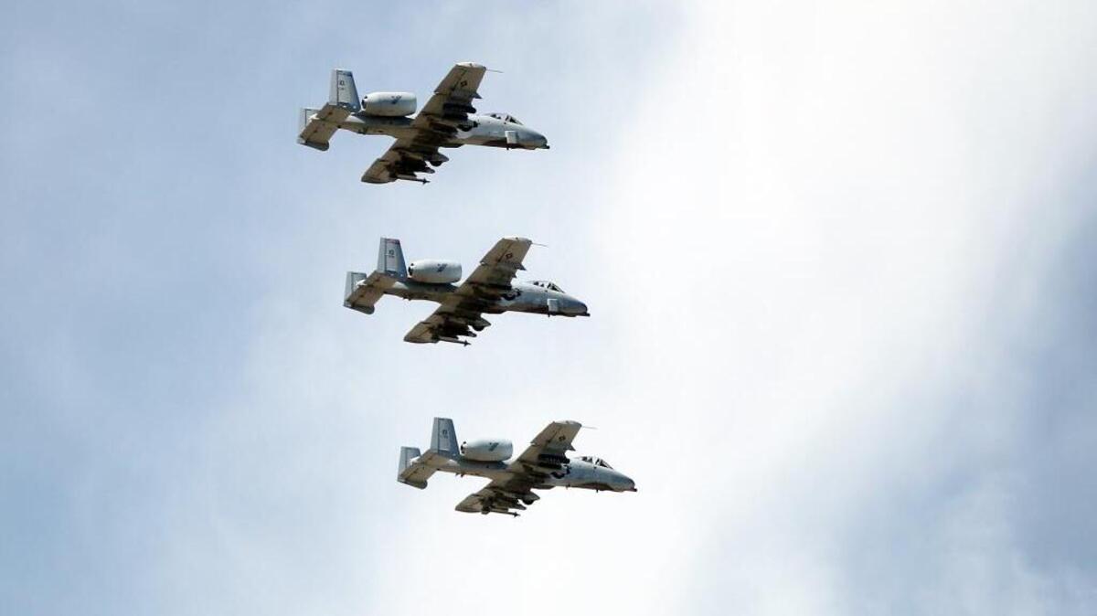 A trio of Idaho National Guard A-10c Thunderbolt II "Warthog" planes fly in formation over the Simplot Sports Complex in June 2013.