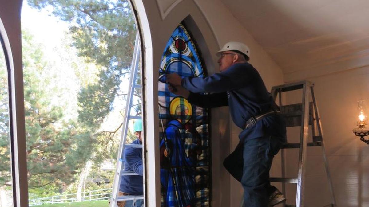David Schlicker removes the exquisite windows from Christ Chapel. They might date to 1870, he said, just a few years after the platting of Boise’s original 10 blocks.