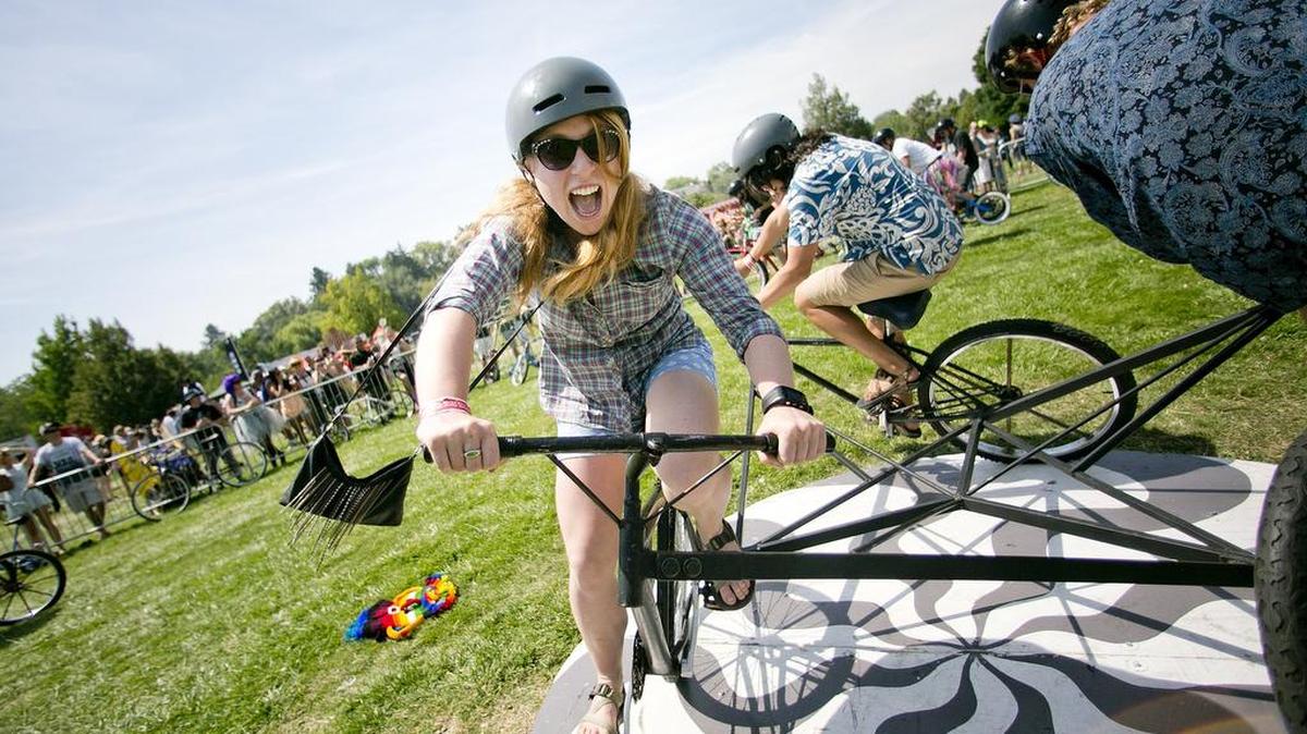 Emma Donohoe screams as she rides an experimental 3-person bike in a circle during last year’s Tour De Fat festival at Ann Morrison Park. This year’s bike and beer event is on Saturday, Aug. 12, and moves to the Idaho Botanical Garden.