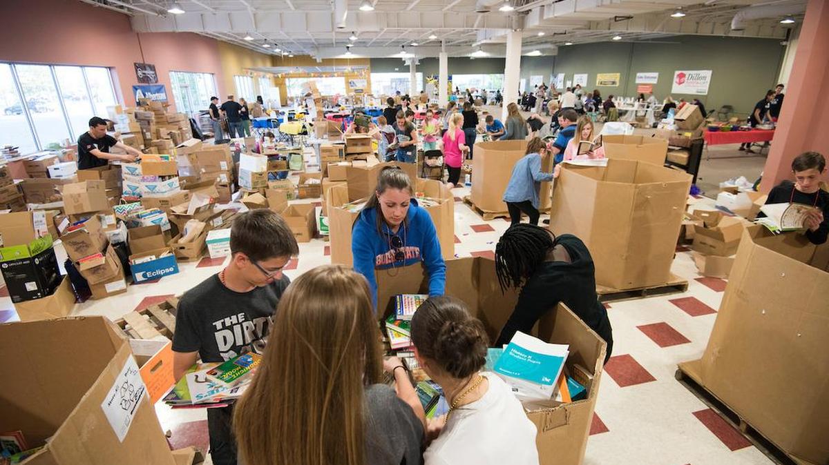 Volunteers at the United Way children’s book drive sort through thousands of donated books in April.