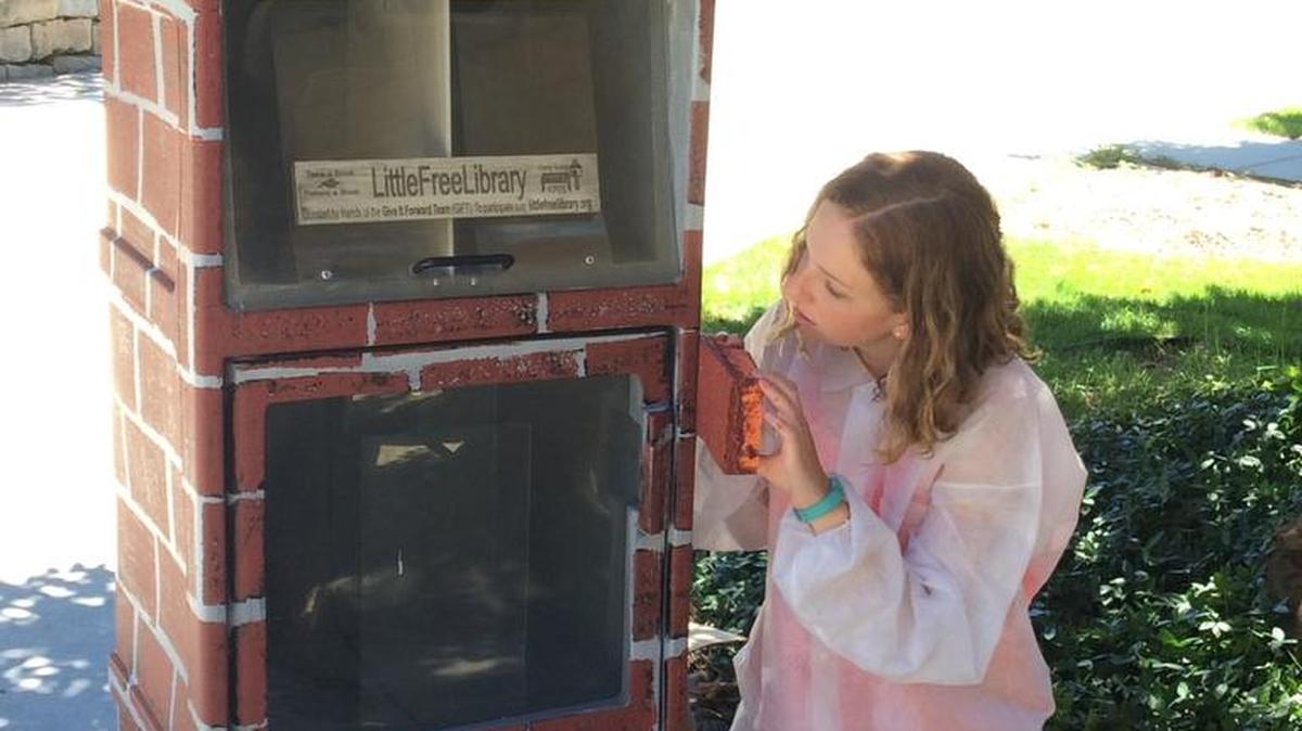 10th-grader Jordan Liebich with one of the three Little Free Libraries she manages in Boise. She’s part of the popular program that provides a free book exchange in neighborhoods across the U.S. and beyond.