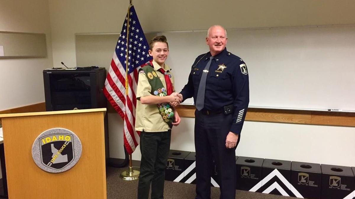 Idaho State Police Col. Ralph Powell thanks Meridian’s Jackson Gardiner, who built 10 training boxes for ISP’s K-9 program.