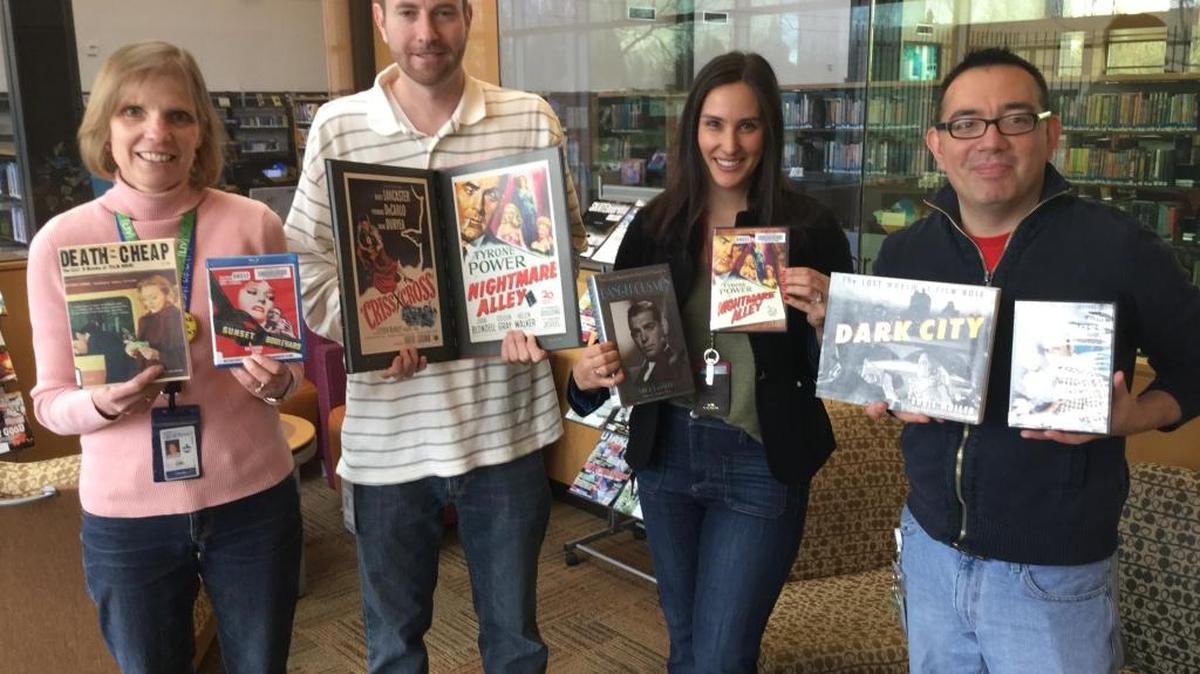 Boise Public Library staffers Lisa Egan, Conner Bevis, Lindsay Zamora and Tom Malinowski show off selections from the library’s film noir collection. The library’s Cole and Ustick branch kicks off a free noir film series on Thursday.