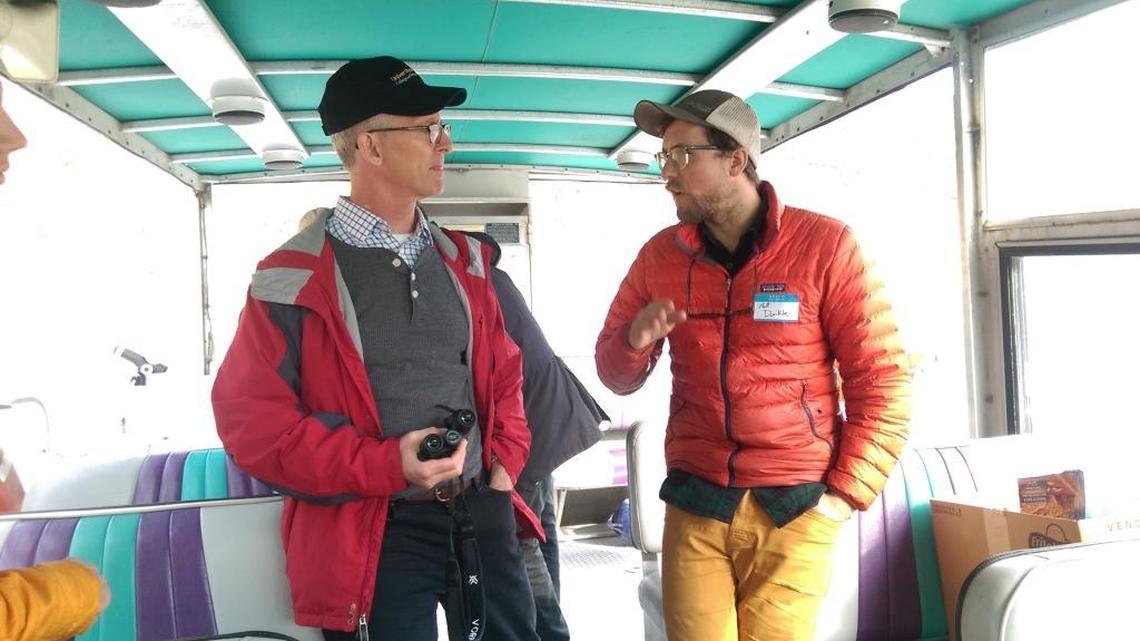 Bob Inglis, a former South Carolina Republican congressman and currently a climate change crusader, talks with University of Idaho fisheries science graduate student Matt Dunkle while on an October 2017 jet boat tour of Hell's Canyon.