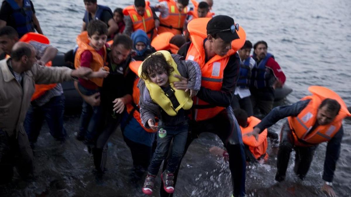 Syrian refugees arrive aboard a dinghy after crossing from Turkey to the island of Lesbos, Greece in September. The U.S. has plans to receive 10,000 Syrian refugees in the next year.