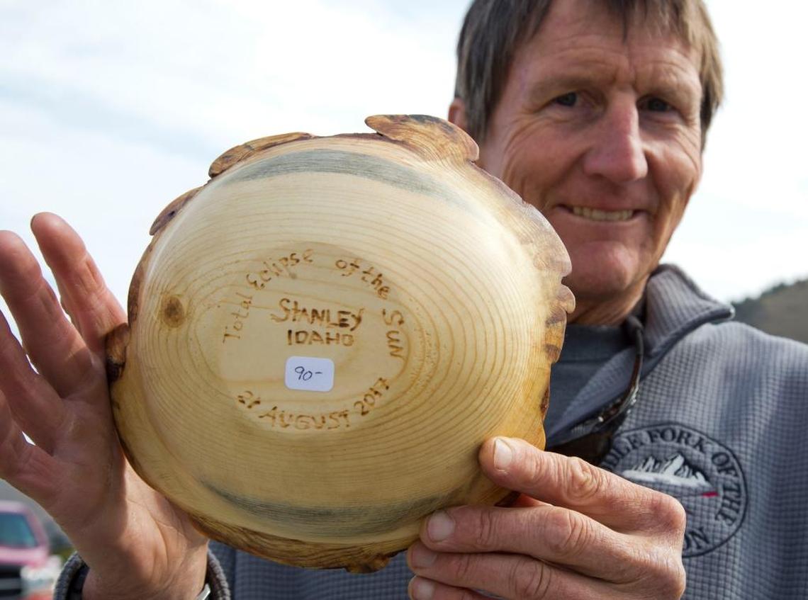 Sean Peteren, a Stanley resident and woodworker, made a series of hand-turned wooden bowls that he’s selling along the highway in Stanley. They’re engraved on the bottom: “Total eclipse of the sun, Stanley, Idaho, 21 August 2017.”