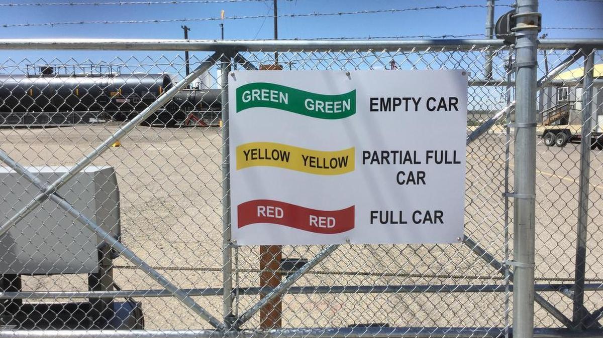 A sign at the Campo & Poole rail yard in Ontario explains tanker markers.