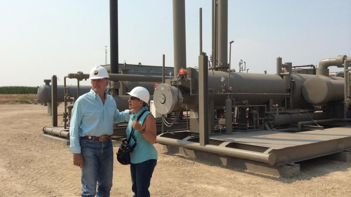 Idaho Gov. Butch Otter talks with former Idaho Petroleum Council executive director Suzanne Budge at the site of Alta Mesa Idaho's gas dehydration plant near New Plymouth in 2014. The future of the council is up in the air and Budge resigned after Alta Mesa demanded her dismissal.
