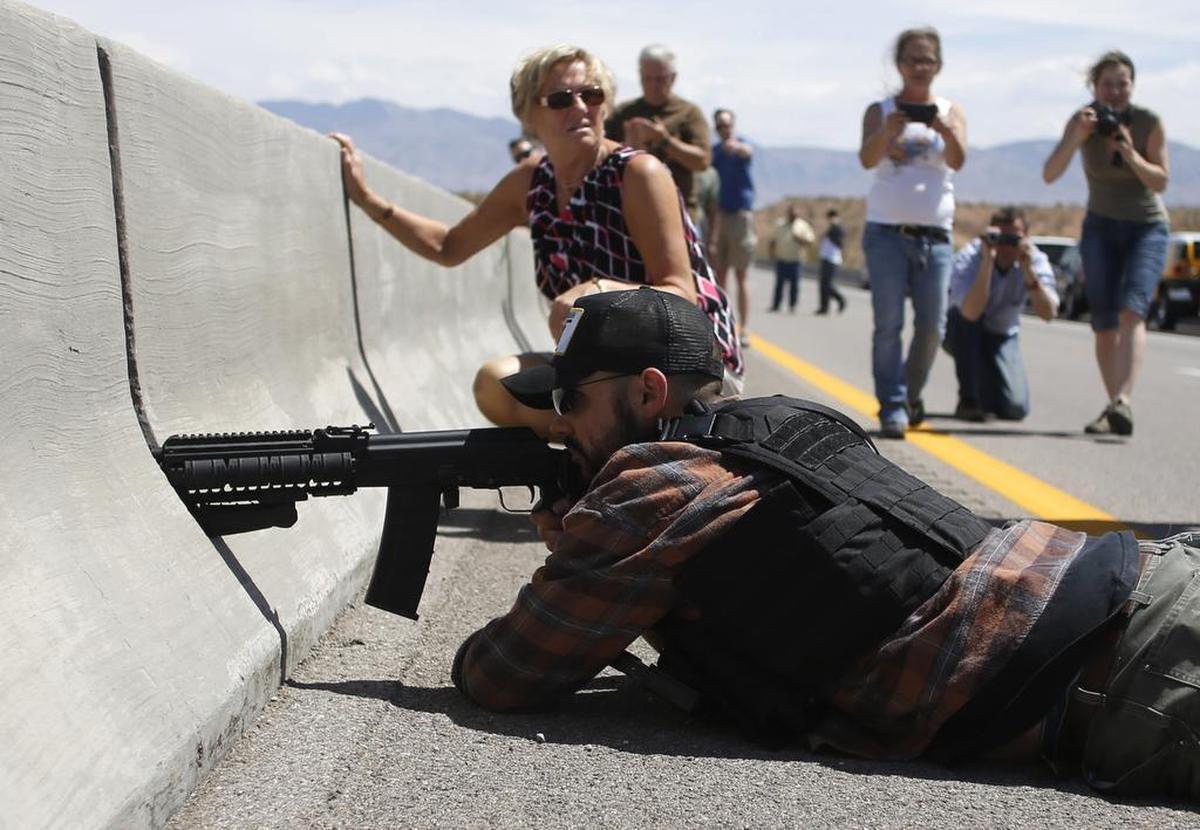 Eric Parker aims his weapon in April 2014 from a bridge next to the Bureau of Land Management’s base camp where seized cattle, belonging to rancher Cliven Bundy, were being held. Parker’s personal profile, Idaho Senate campaign page and Real 3%ers of Idaho page were removed from Facebook during a ban on militia groups and “dangerous organizations” on the social media site.