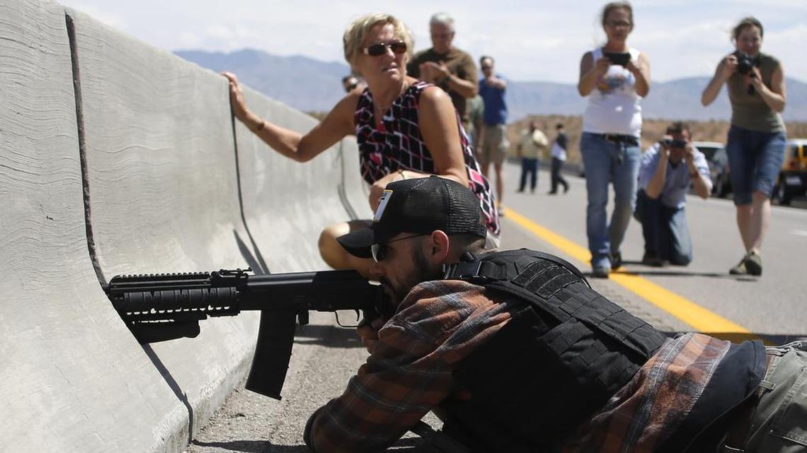 Eric Parker aims his weapon in April 2014 from a bridge next to the Bureau of Land Management’s base camp where seized cattle, belonging to rancher Cliven Bundy, were being held.