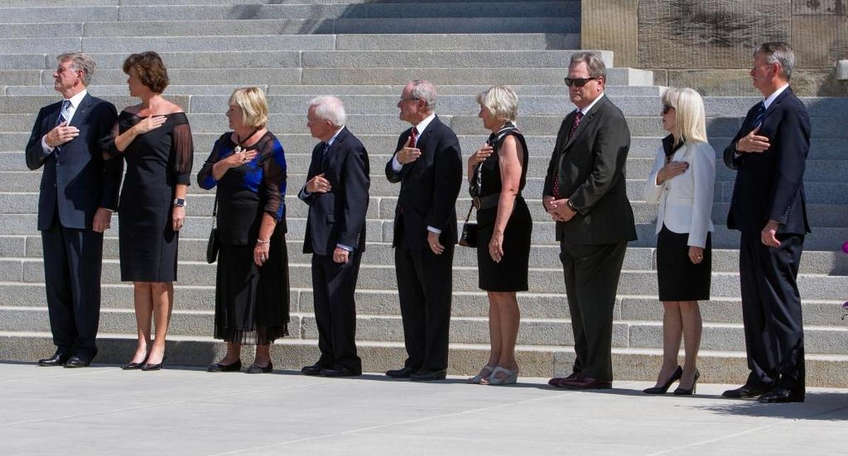 Sen. Jim Risch, center, and Rep. Mike Simpson, third from right, were among those lined up to honor former Gov. Cecil Andrus as his casket arrived at the Idaho Statehouse in August 2017.
