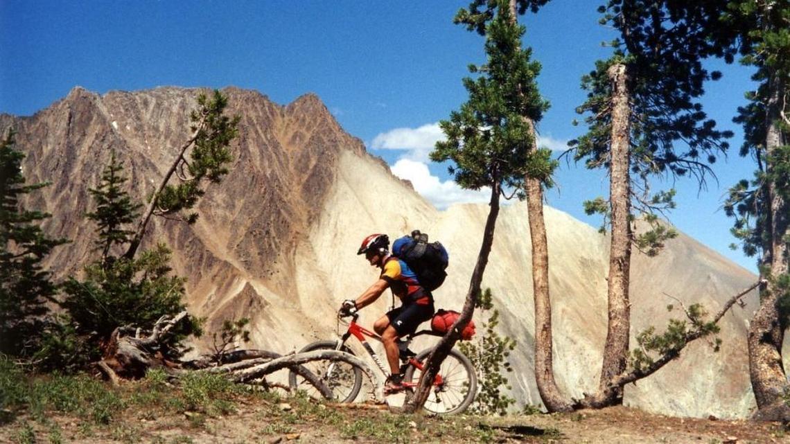 Rick Lundgren pedals over the pass overlooking Castle Peak, prior to its inclusion in the White Clouds Wilderness in legislation passed in 2015. The trail is now closed to bikers.