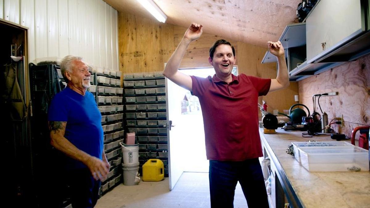 Sonny Gilbreath, left watches his son Blane Gilbreath dance to Linda Ronstadt in a shop on their property in Post Falls, Idaho on Monday, July 20, 2015. Blane suffered severe head injuries in a car accident in 1986. (Kathy Plonka/The Spokesman-Review via AP)