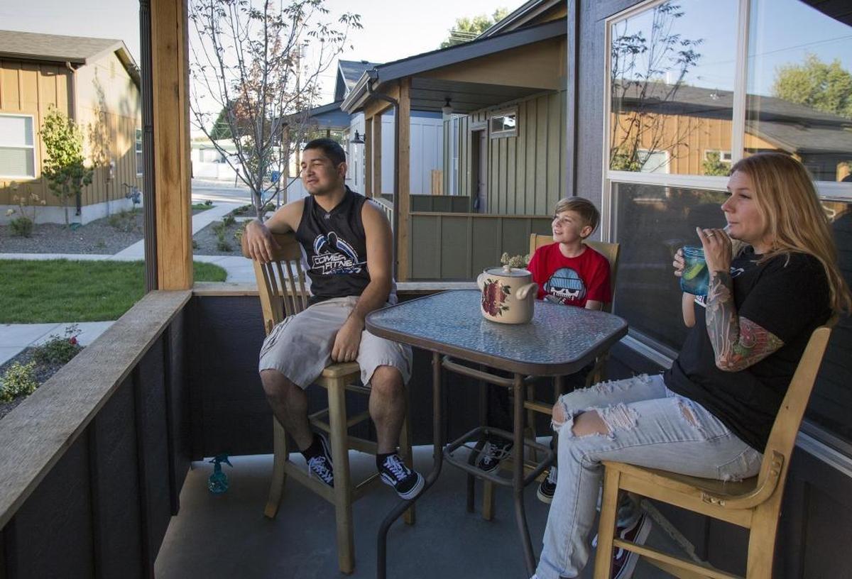 Andrew and Shay Cruz, with their son Tyran, 10, and the family dog, Dan, live in one of the new "pocket neighborhoods" in Garden City. Their incomes limited where they could afford to buy a house, and Garden City fit the bill.