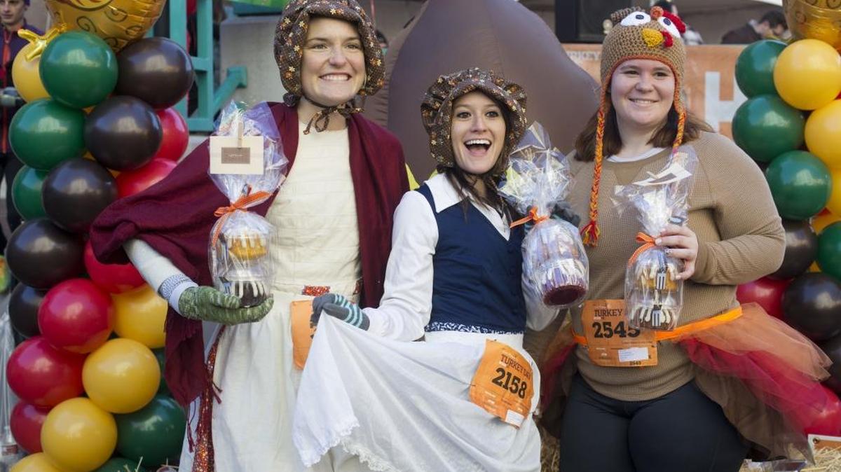 This was the first Turkey Day Run for Michelle Gauron, right, so co-workers Tanya Turner, left, and Kristina Bird came along for moral support. “So we can eat more later,” says Turner.