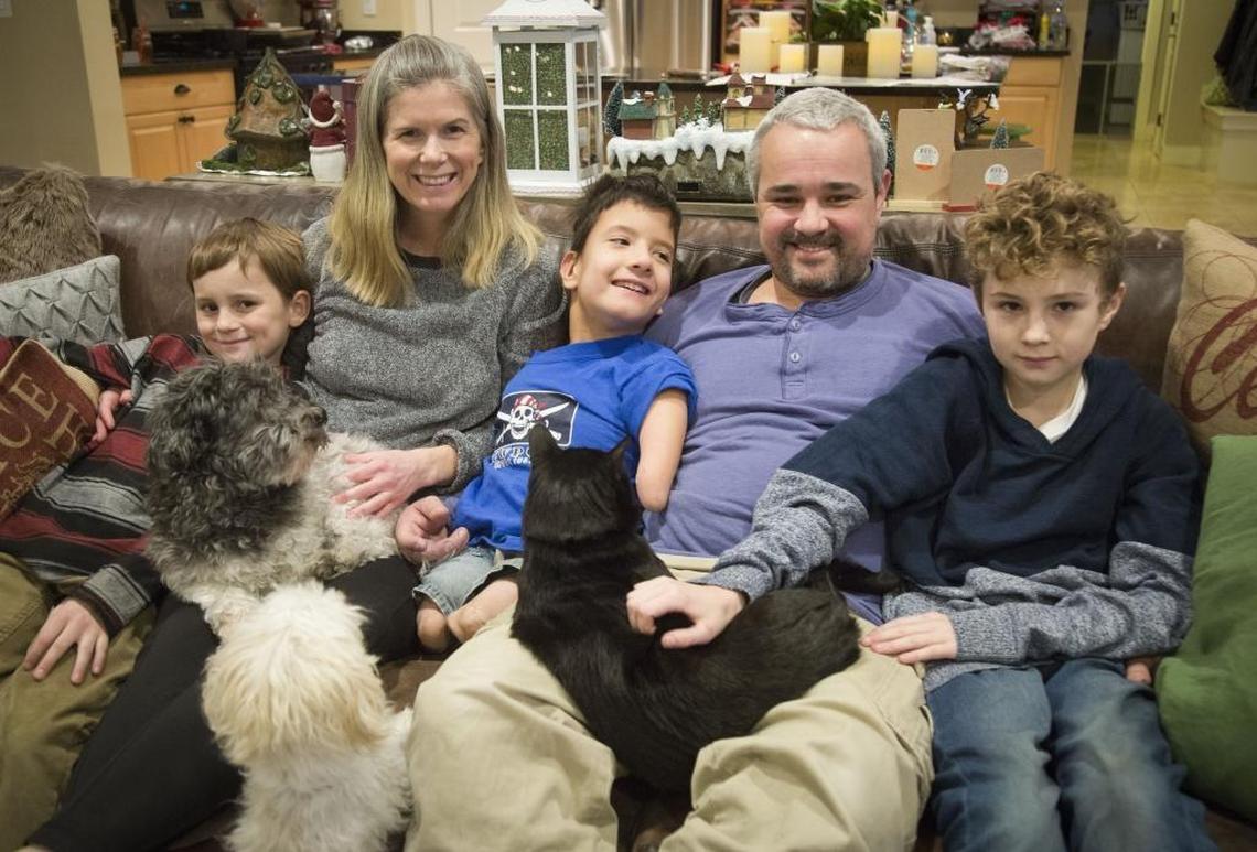 Devon and Jeremy Toomey adopted Bowen in 2010, joining brothers Brooks, left, and Heath. The family also has four dogs, two cats and two chickens.