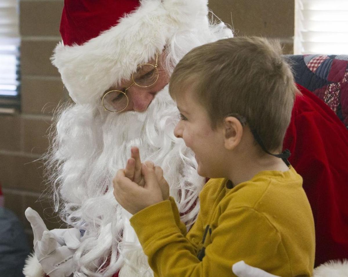 With sign language, 4-year-old Jacob Matthews and Santa discuss how old Jacob is, whether he’s on the naughty or nice list and what Jacob wants for Christmas (model race cars). Santa only promises a “surprise” on Christmas morning.