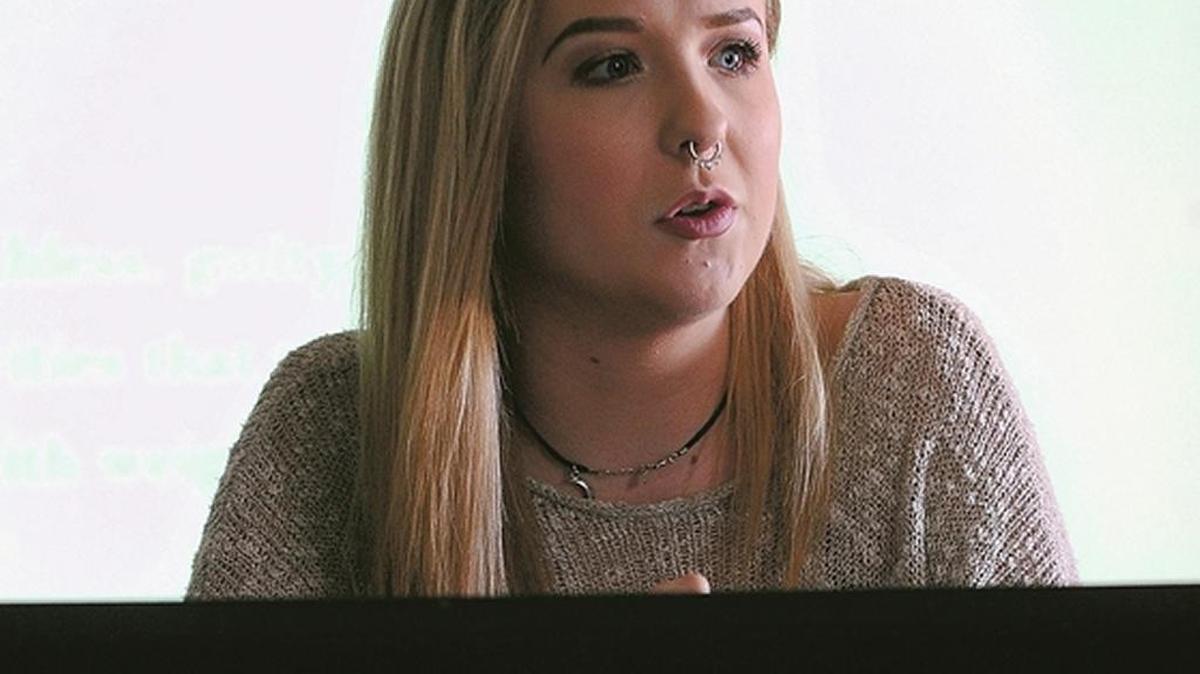 Idaho Falls High senior Ally Harrup gives a presentation on mental illness to students in a sophomore health class at the school.