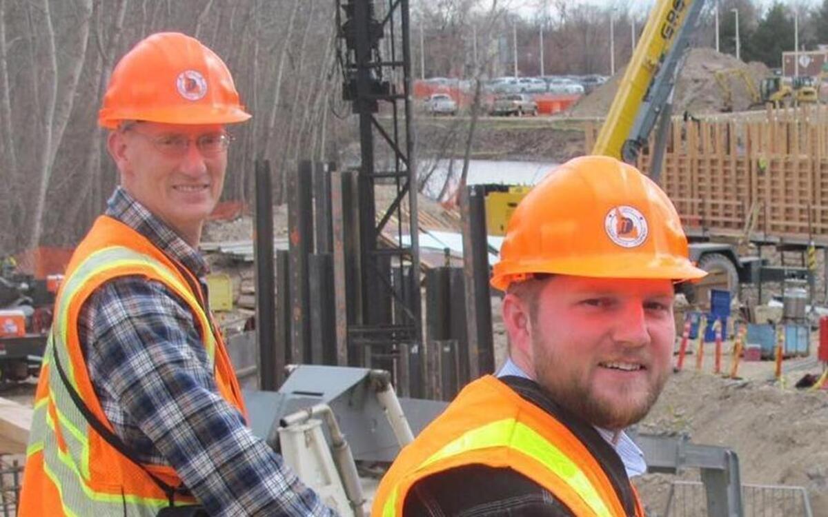 Ken Clausen, left, and Camron Sobotka on the Broadway Bridge site earlier this year. Clausen, the lead designer on the new Broadway Bridge, died in March. The new bridge will open on Friday, Sept. 9.