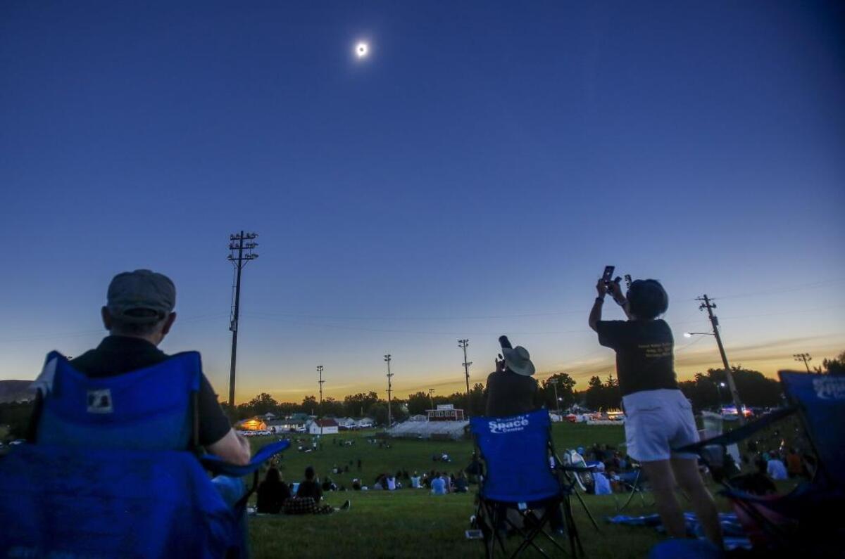 Eclipse watchers at Memorial Park look at the sun and moon at totality during the total solar eclipse in Weiser in 2017.