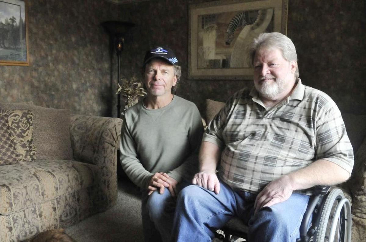 Rick Holmes, left, has been friends with Milo Hatt since childhood. Holmes said the accident that occurred 46 years ago on a dark street – Hatt was driving a car that hit a marching band – could have happened to anyone.