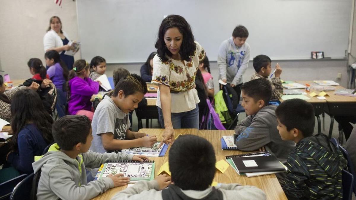 Teacher Monica Villegas — an exchange teacher from Mexico — instructs students at the Twin Falls School District's migrant summer school in June.