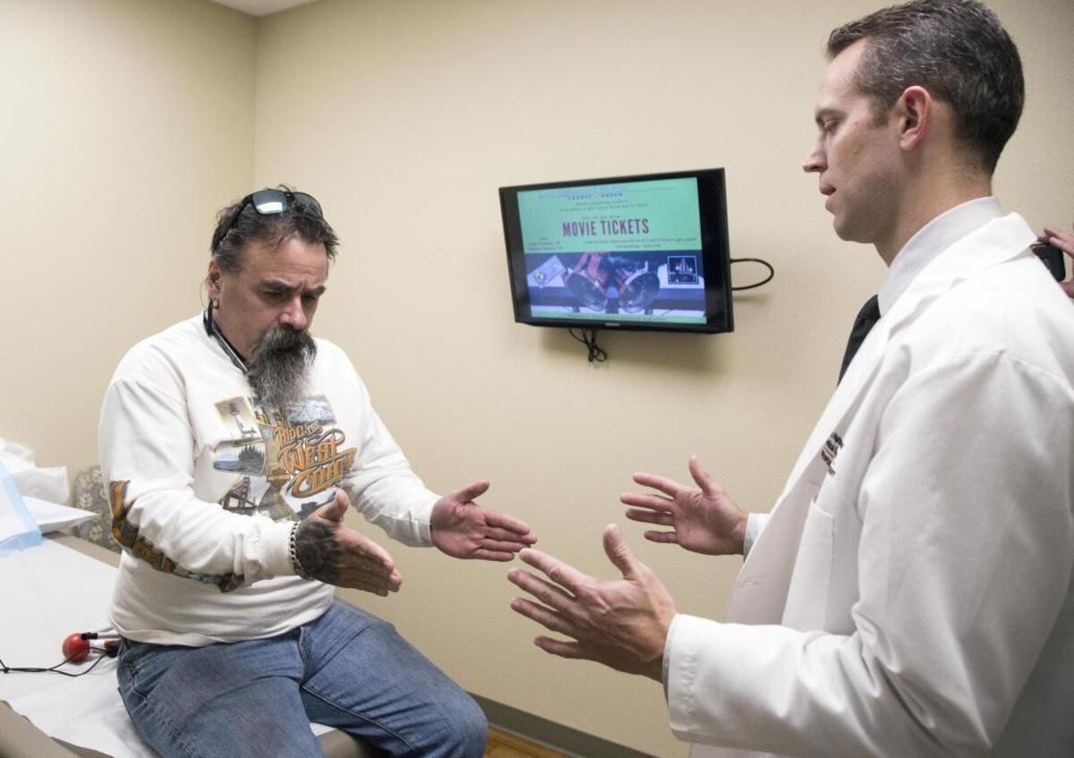 Jamie Harrell visits Dr. Darin Jurgensmeier at the Saint Alphonsus Joint Preservation and Reconstruction office in Boise. Jurgensmeier was one of the doctors who was called in to initially treat Harrell after he was struck by a car on Jan. 1, 2017.