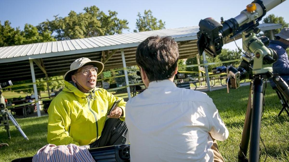 Tsutomu “Ben” Soejima, leader of a group Japanese eclipse tourists visiting Weiser, reads off GPS coordinates to members who are in town for the eclipse. Soejima now has seen 15 total eclipses and will take the tour group to Chile for the 2019 eclipse. Soejima chose Weiser over Rexburg because of the cheaper cost and accessibility from Boise.