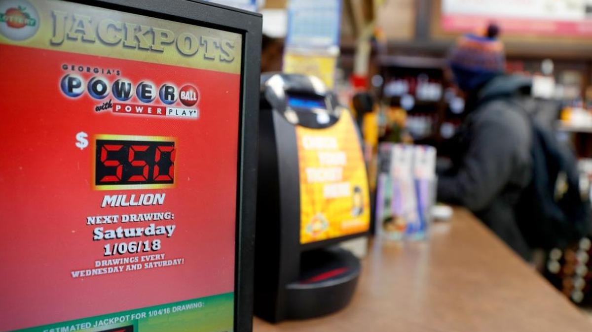 The estimated Powerball jackpot in Saturday night’s drawing is up to $570 million. A sign advertises the jackpot at a store in Atlanta.