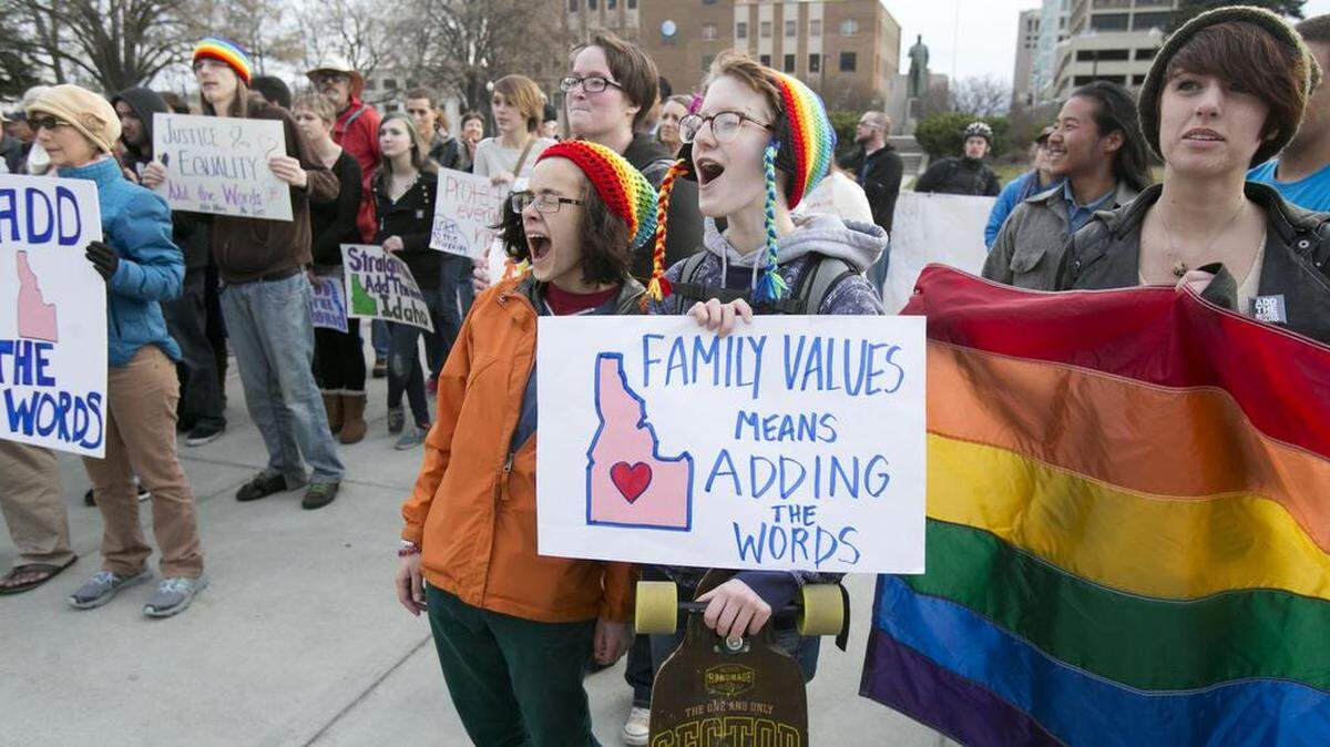 Liz Keyes, 18, (with sign) and Ghanda Hendryx, 18, were among several hundred people who rallied at and walked around the Idaho Capitol in 2015 in support of Add the Words. Rep. John McCrostie, a Garden City Democrat, on Monday introduced a the bill again to protect LGBTQ residents from discrimination.