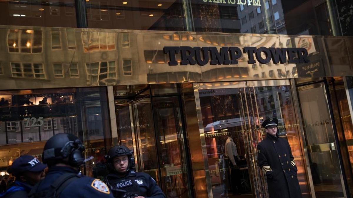 New York Police Department officers stand guard outside Trump Tower, on Fifth Avenue in Manhattan.