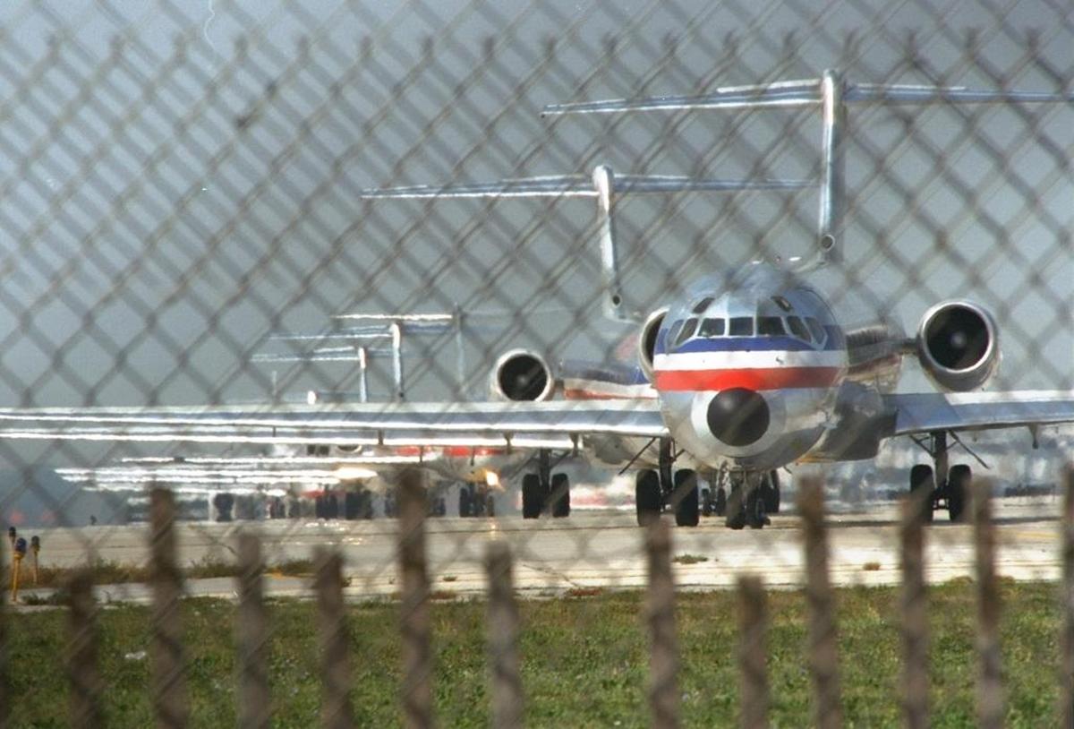 Planes line up on the runway at O’Hare International Airport in Chicago.