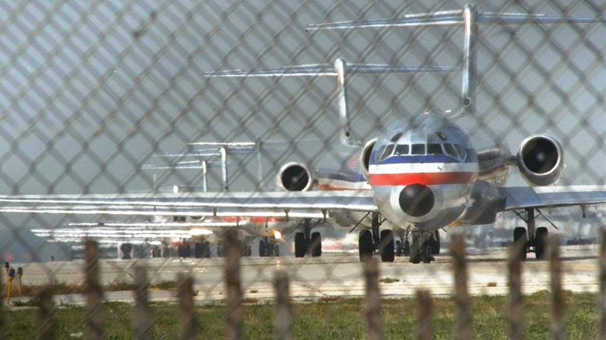 Planes line up on the runway at O'Hare International Airport in Chicago.