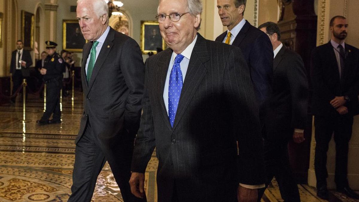 Senate Majority Leader Mitch McConnell, R-Ky., center, Senate Majority Whip John Cornyn, R-Texas, left, and Sen. John Thune, R-S.D., walk to a news conference Tuesday.