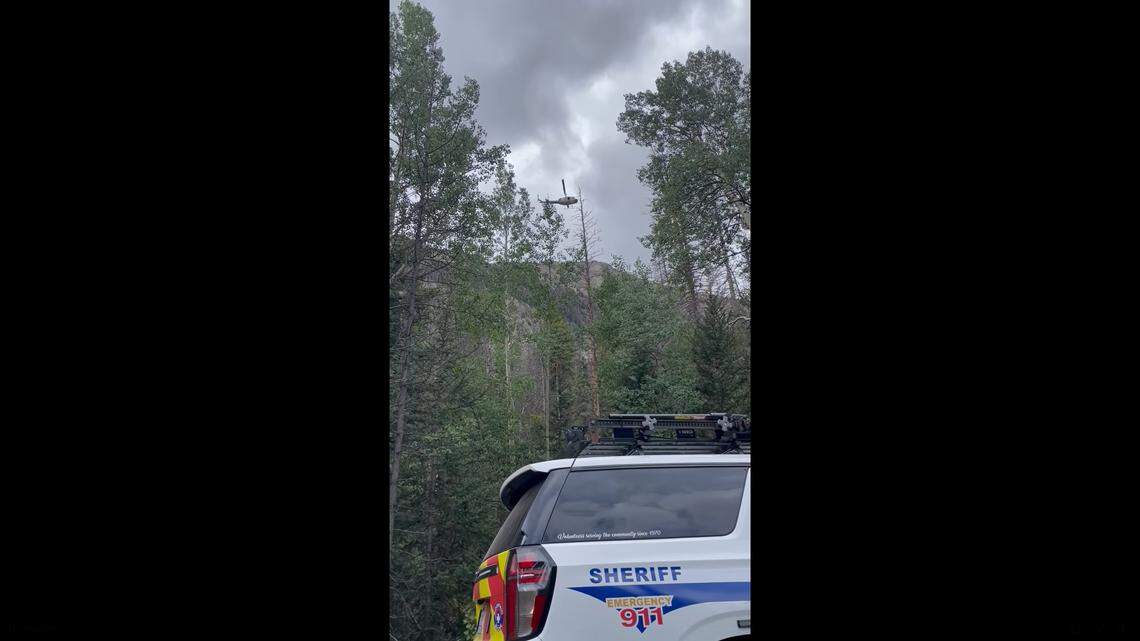 A hiker spent the night alone on a frigid Colorado mountain after his co-workers left him to complete the final summit push on his own.