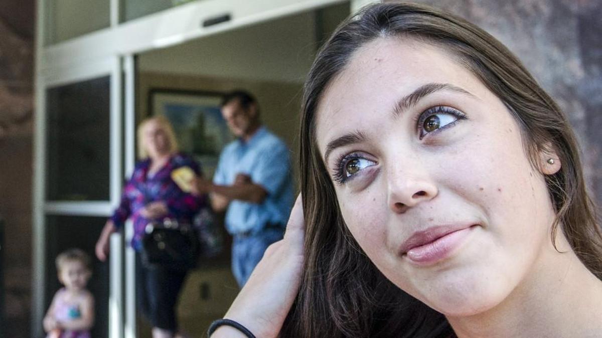 In Topeka on Monday, 19-year-old Victoria Sharp talked about an attempt to get a Kansaas judge to award custody of her siblings to her father so they can live together in Colorado. She spoke outside the Shawnee County Courthouse in Topeka. In July, a judge removed the children from the Auburn, Kan., home of their mother, Odalis Sharp, after they testified of beatings and other abuse. The family rose to national prominence earlier this year when they performed for armed occupiers who took over the Malheur National Wildlife Refuge in Oregon.