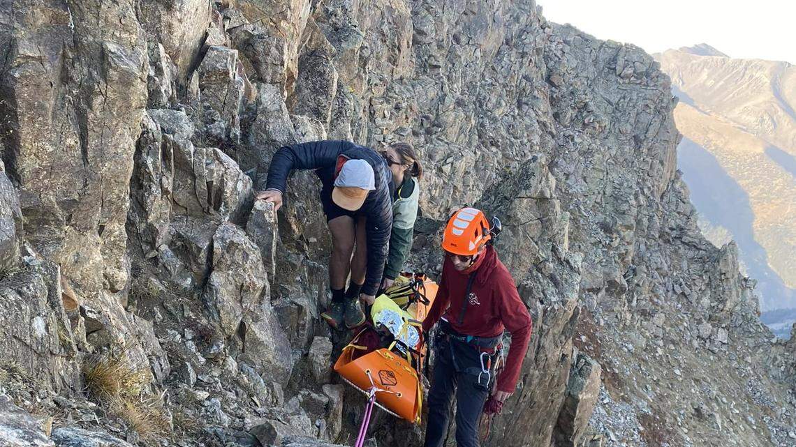 A solo hiker fell about 30 feet from a steep ridge on a Colorado mountain at about 13,000 feet of elevation, and had to wait overnight for rescue — with a broken back, rescuers said.
