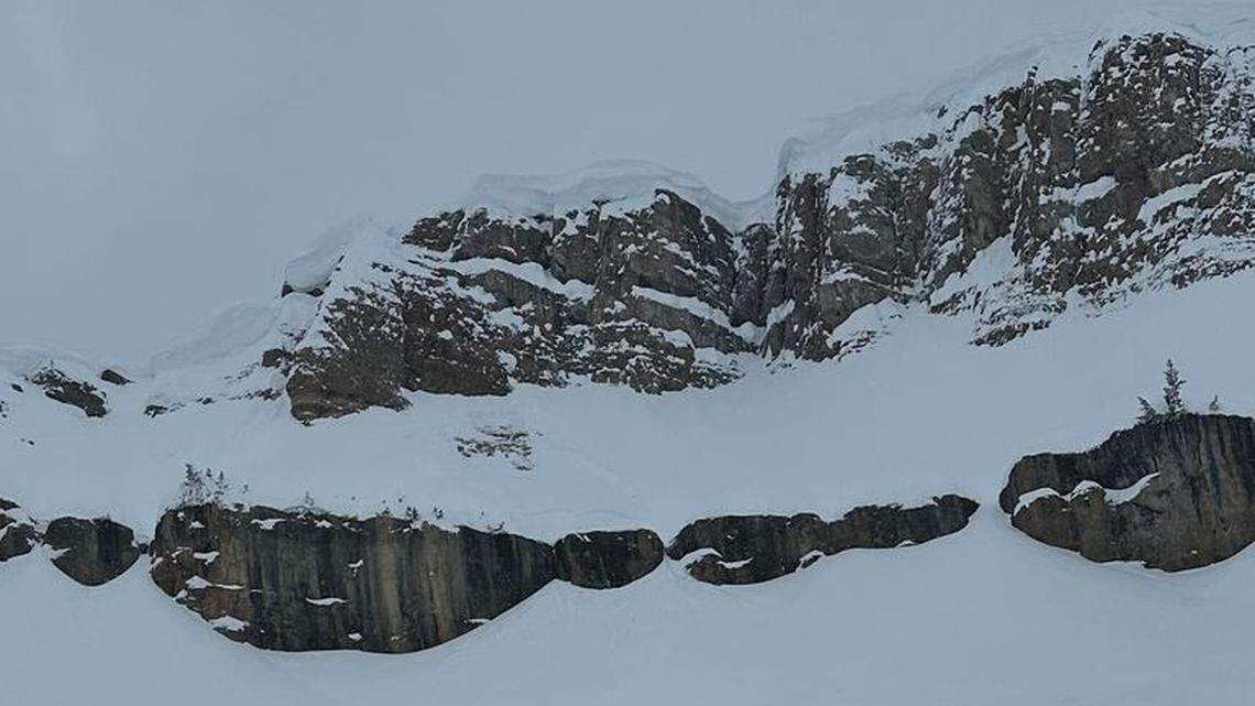 A cornice broke under an out-of-bounds skier and sent him plunging 100 feet into the basin below in the Grand Teton backcountry.